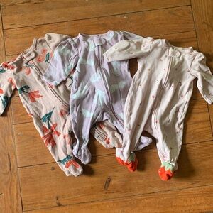 Three 3-month Carter’s long sleeved, two-way zippered onesies